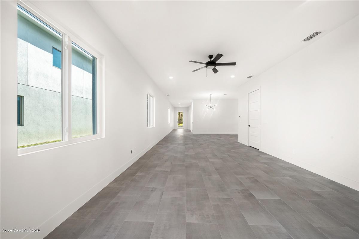 2168 Country Club Road Melbourne, FL 32901 - Photo 24 of 94 a view of a livingroom with a ceiling fan and window