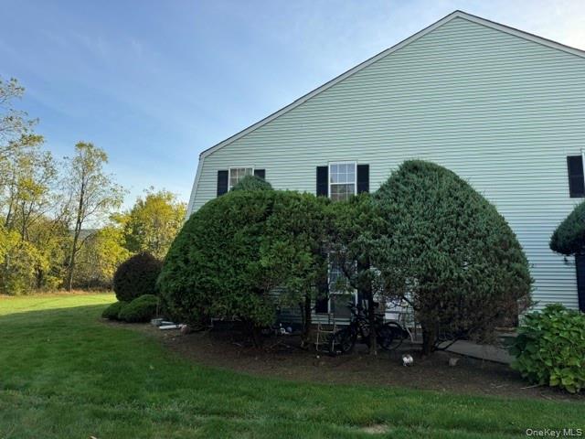 24 The Rise Warwick, NY 10990 - Photo 2 of 4 a view of a backyard with plants and a large tree