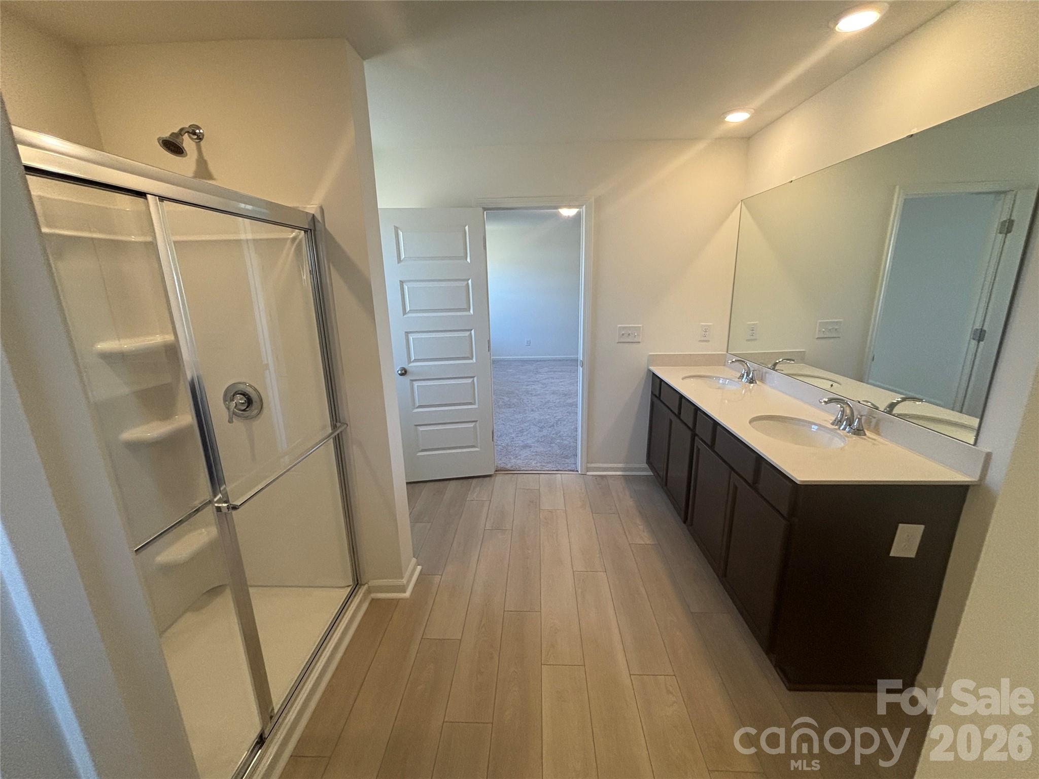 357 Roxanna Lane, Unit 72 York, SC 29745 - Photo 18 of 23 a bathroom with a sink a mirror and a shower