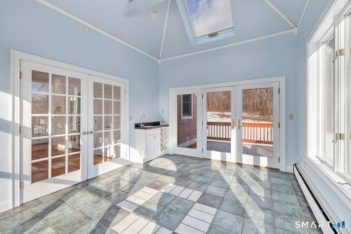 461 Amity Road Woodbridge, CT 06525 - Photo 24 of 40 a view of a bedroom with wooden floor and windows