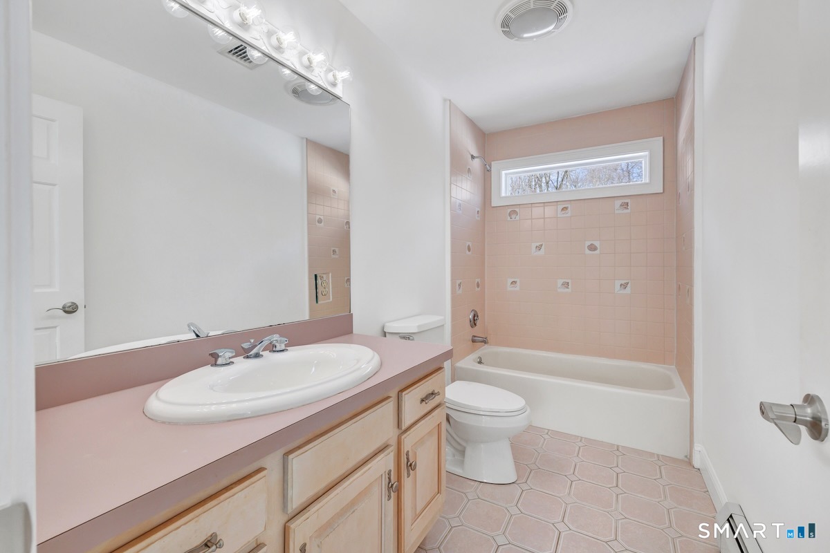 461 Amity Road Woodbridge, CT 06525 - Photo 28 of 40 a bathroom with a sink a toilet and shower