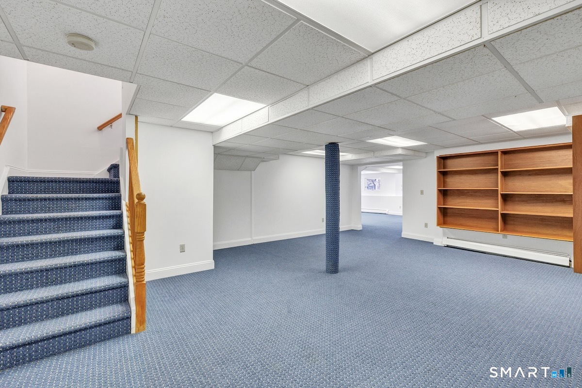 461 Amity Road Woodbridge, CT 06525 - Photo 34 of 40 a view of an empty room with stairs