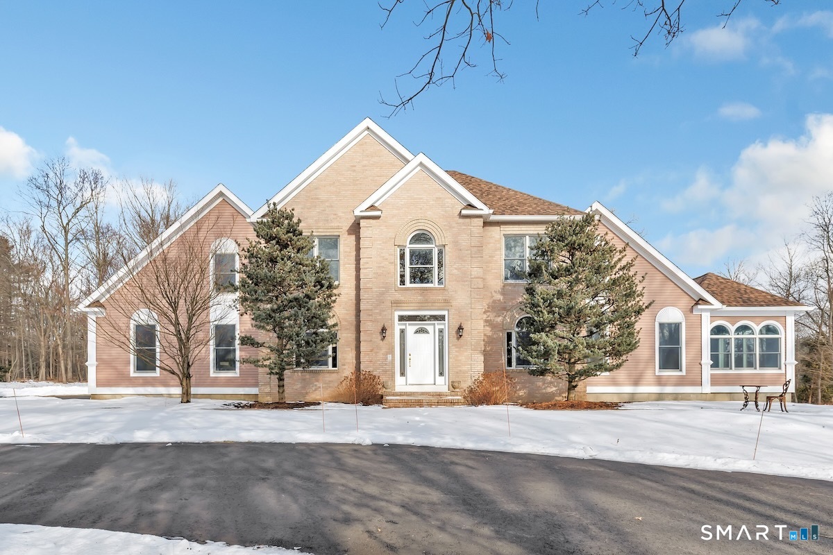 461 Amity Road Woodbridge, CT 06525 - Photo 4 of 40 a front view of a house with a road