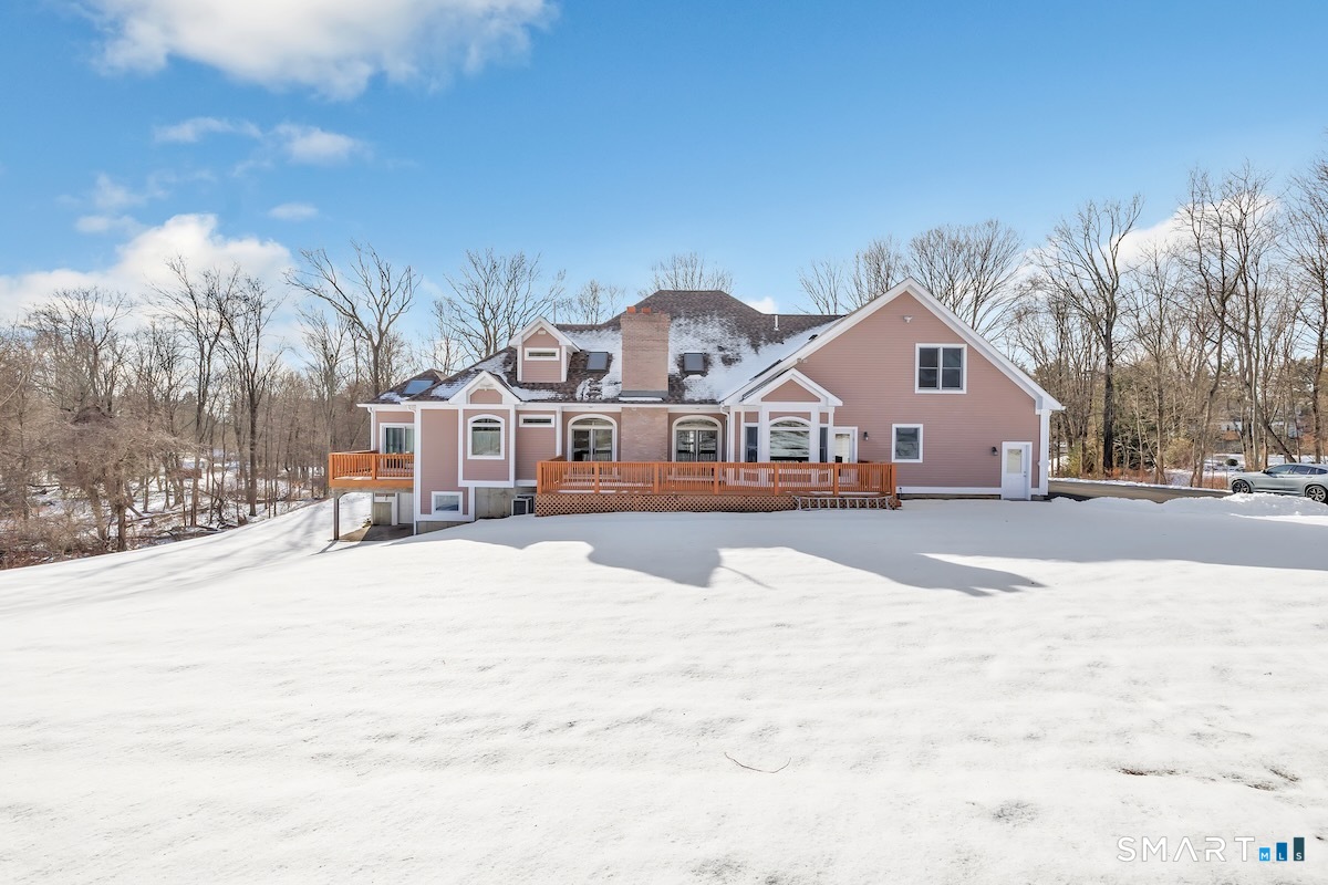 461 Amity Road Woodbridge, CT 06525 - Photo 5 of 40 a view of house with snow on the road