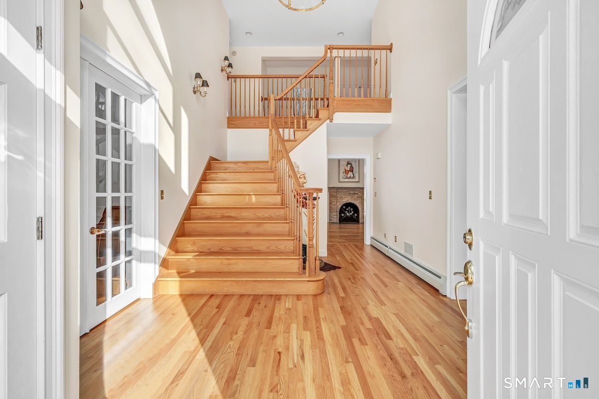 461 Amity Road Woodbridge, CT 06525 - Photo 9 of 40 a view of entryway and hall with wooden floor