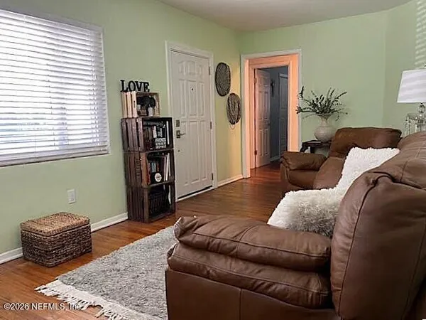 a living room with furniture and a window