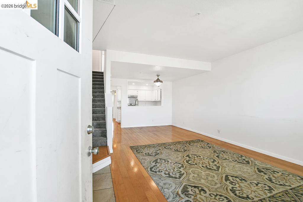 3487 Wells Road Oakley, CA 94561 - Photo 11 of 30 Living room featuring light wood finished floors and stairway