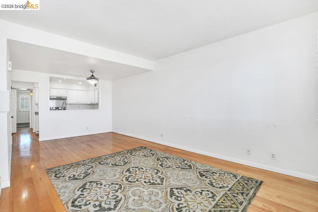3487 Wells Road Oakley, CA 94561 - Photo 12 of 30 Unfurnished living room featuring light wood-style flooring and baseboards