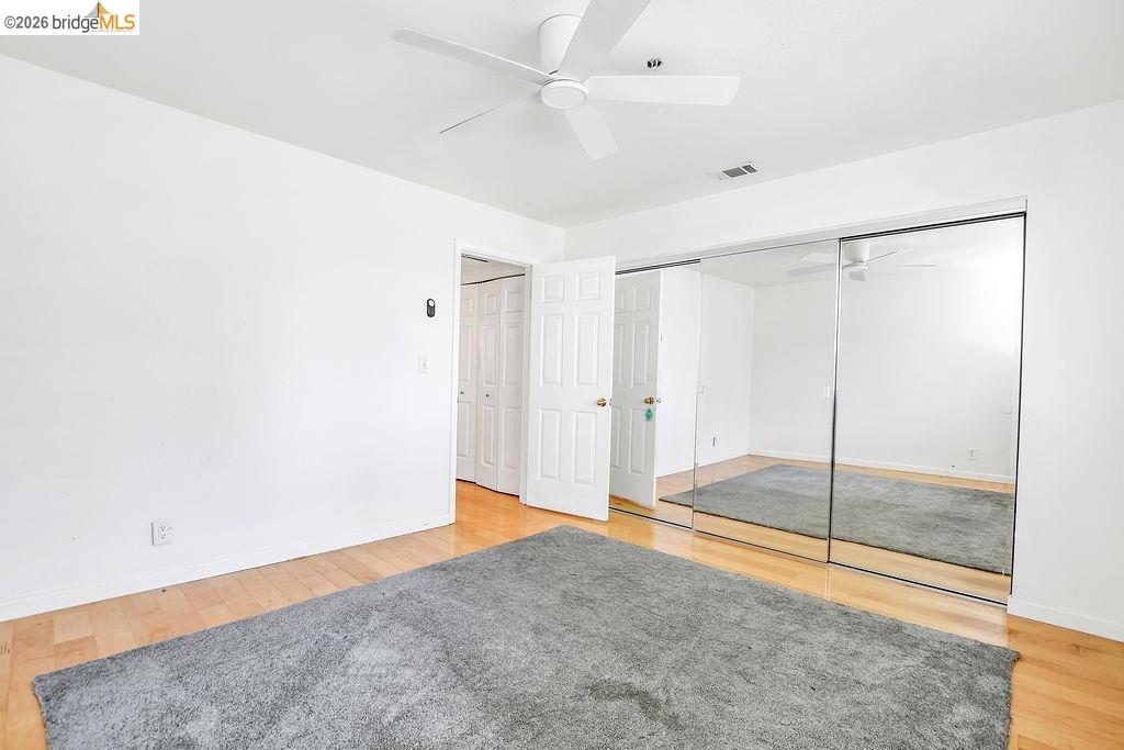 3487 Wells Road Oakley, CA 94561 - Photo 20 of 30 Unfurnished bedroom with light wood-style floors, a closet, and a ceiling fan
