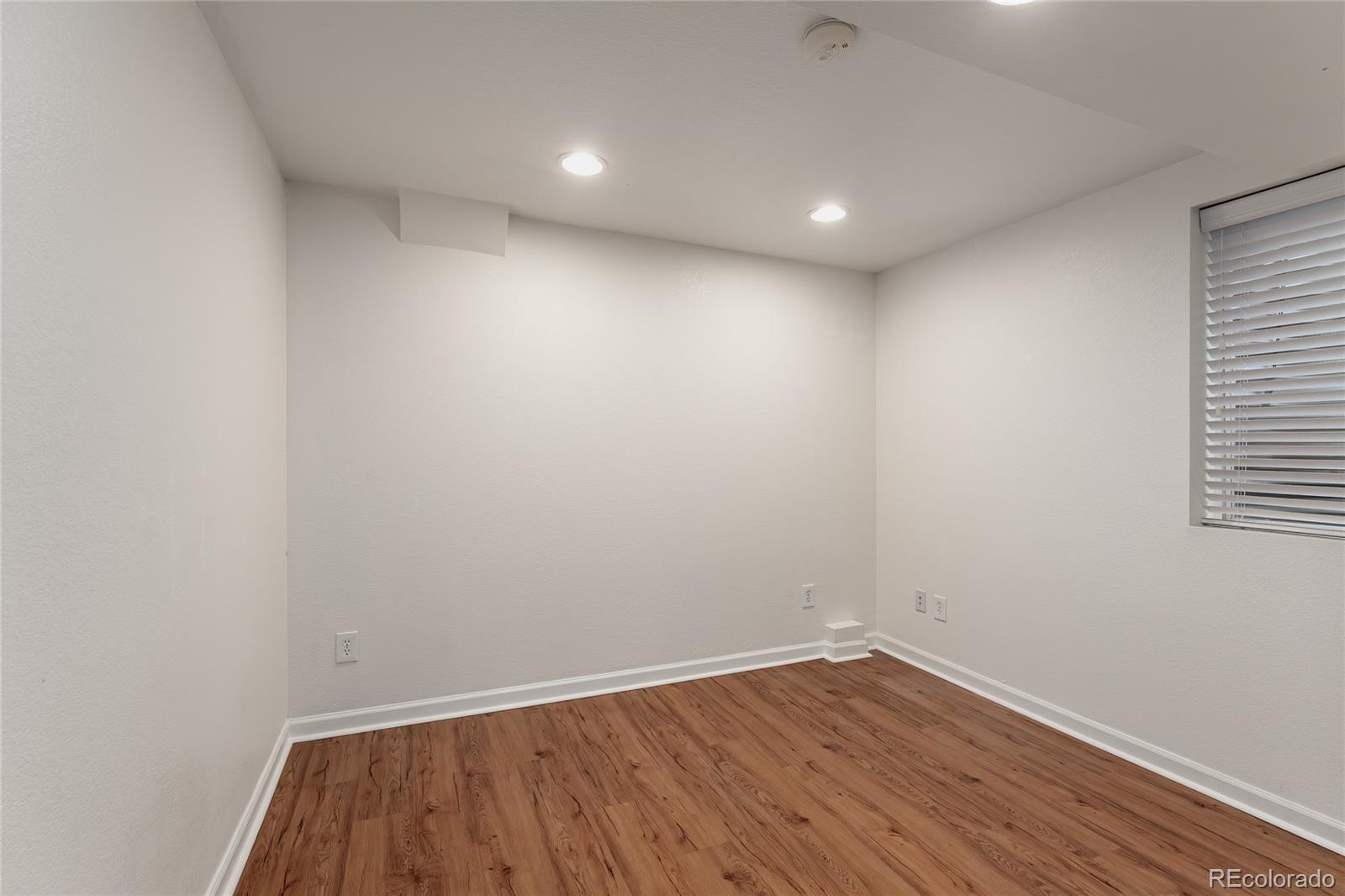 9441 South Hackberry Lane Highlands Ranch, CO 80129 - Photo 42 of 50 a view of empty room with wooden floor