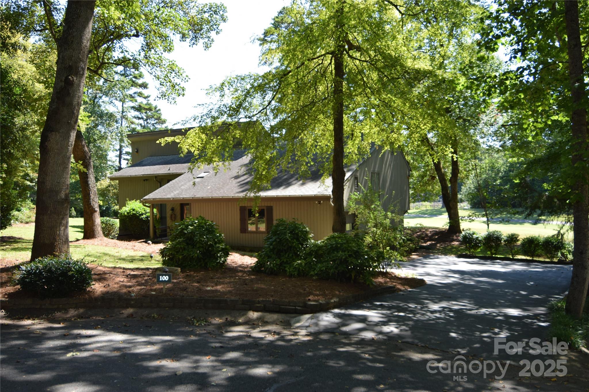 a view of a street in front of a house