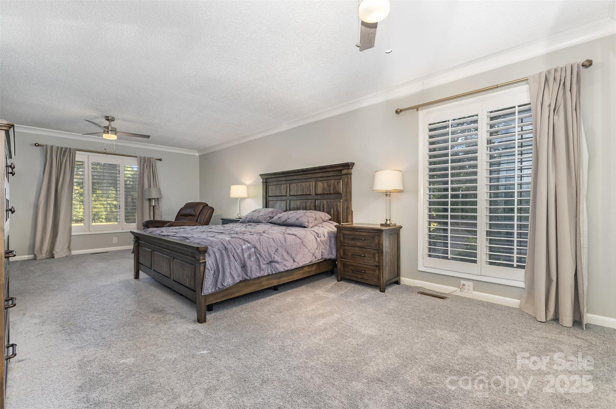 100 Fairway Ridge Clover, SC 29710 - Photo 17 of 45 a bedroom with a bed and a chandelier