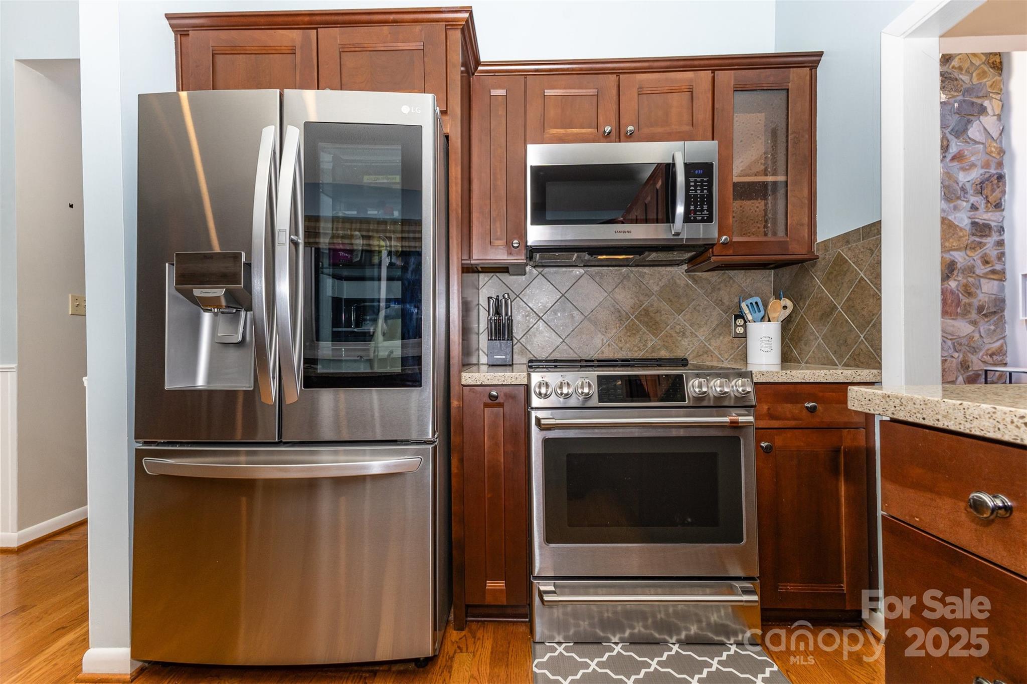 100 Fairway Ridge Clover, SC 29710 - Photo 31 of 45 a kitchen with stainless steel appliances granite countertop a refrigerator stove and microwave