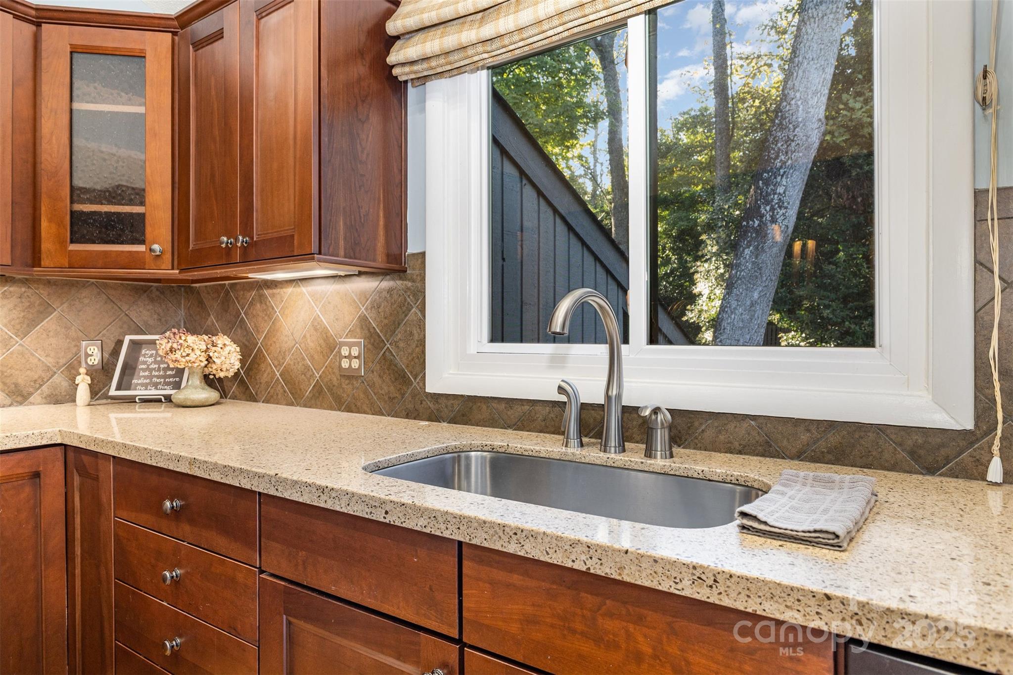 100 Fairway Ridge Clover, SC 29710 - Photo 32 of 45 a kitchen with granite countertop a sink and a large window