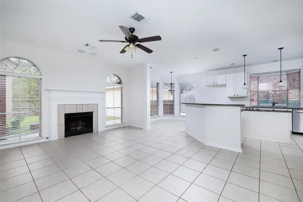 a view of a kitchen with furniture and a fireplace