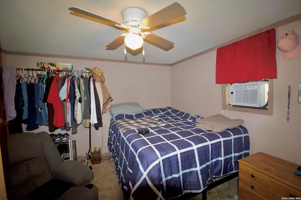a bedroom with a bed and a closet