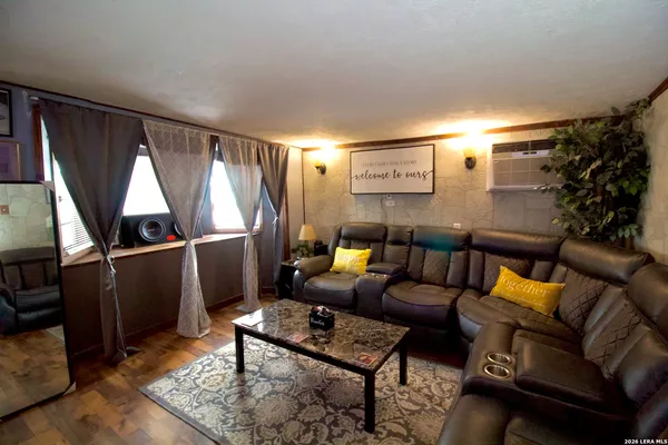 a outdoor living with furniture a rug and a window