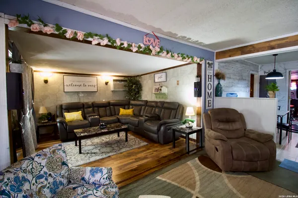 a living room with furniture and a rug