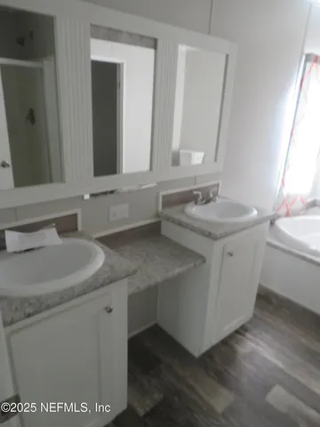 a bathroom with a sink and a mirror