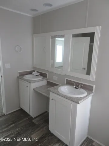 a utility room with sink dryer and washer