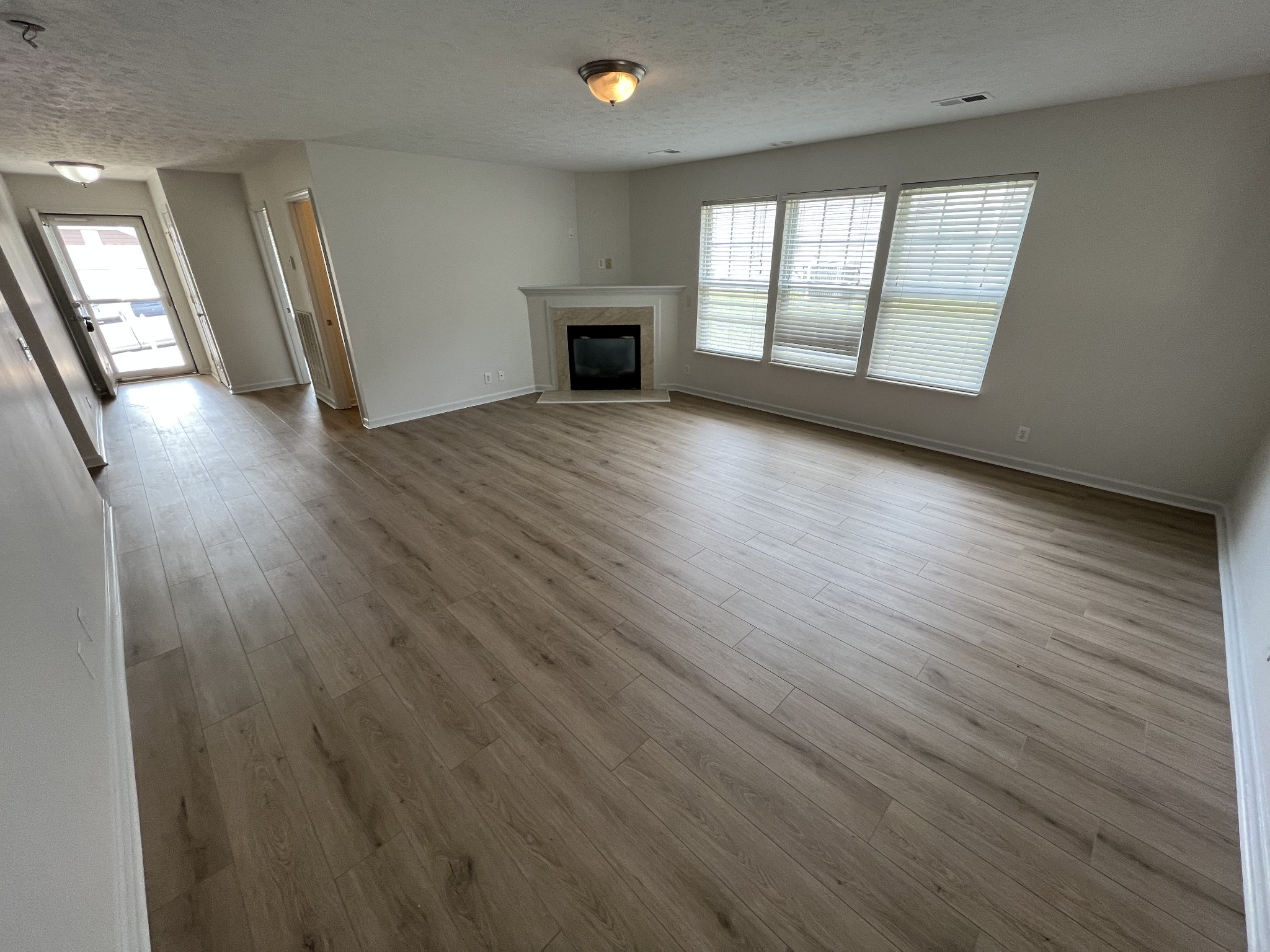 3965 Stephens Ridge Way Antioch, TN 37013 - Photo 4 of 17 wooden floor in an empty room with a window