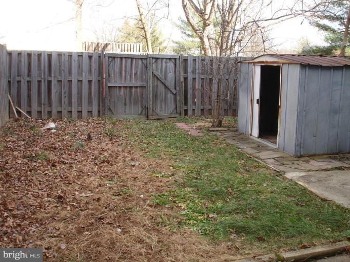 7537 Remington Road Manassas, VA 20109 - Photo 2 of 4 a view of a backyard with wooden fence