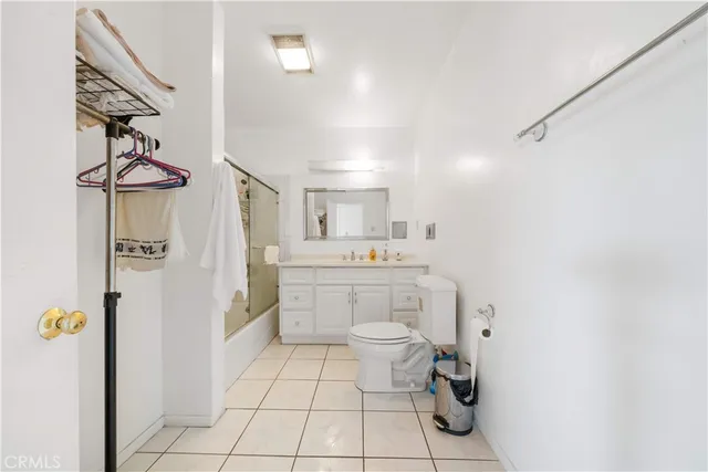 a view of a backyard with plants and a patio