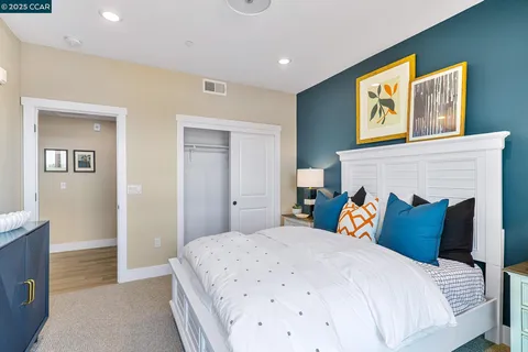 a bedroom with bed and a fireplace