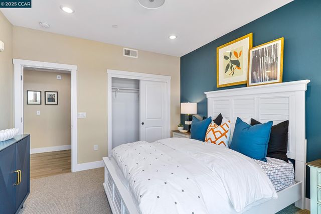 a bedroom with bed and a fireplace