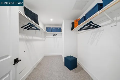 a hallway view with staircase