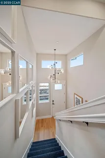a view of a kitchen with wooden floor and a sink