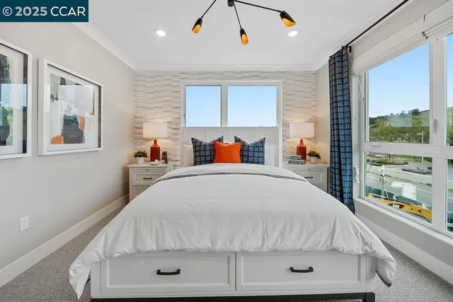 a bedroom with a bed and window