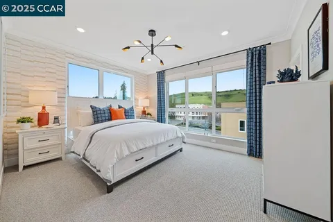 a bed room with a bed and a large window