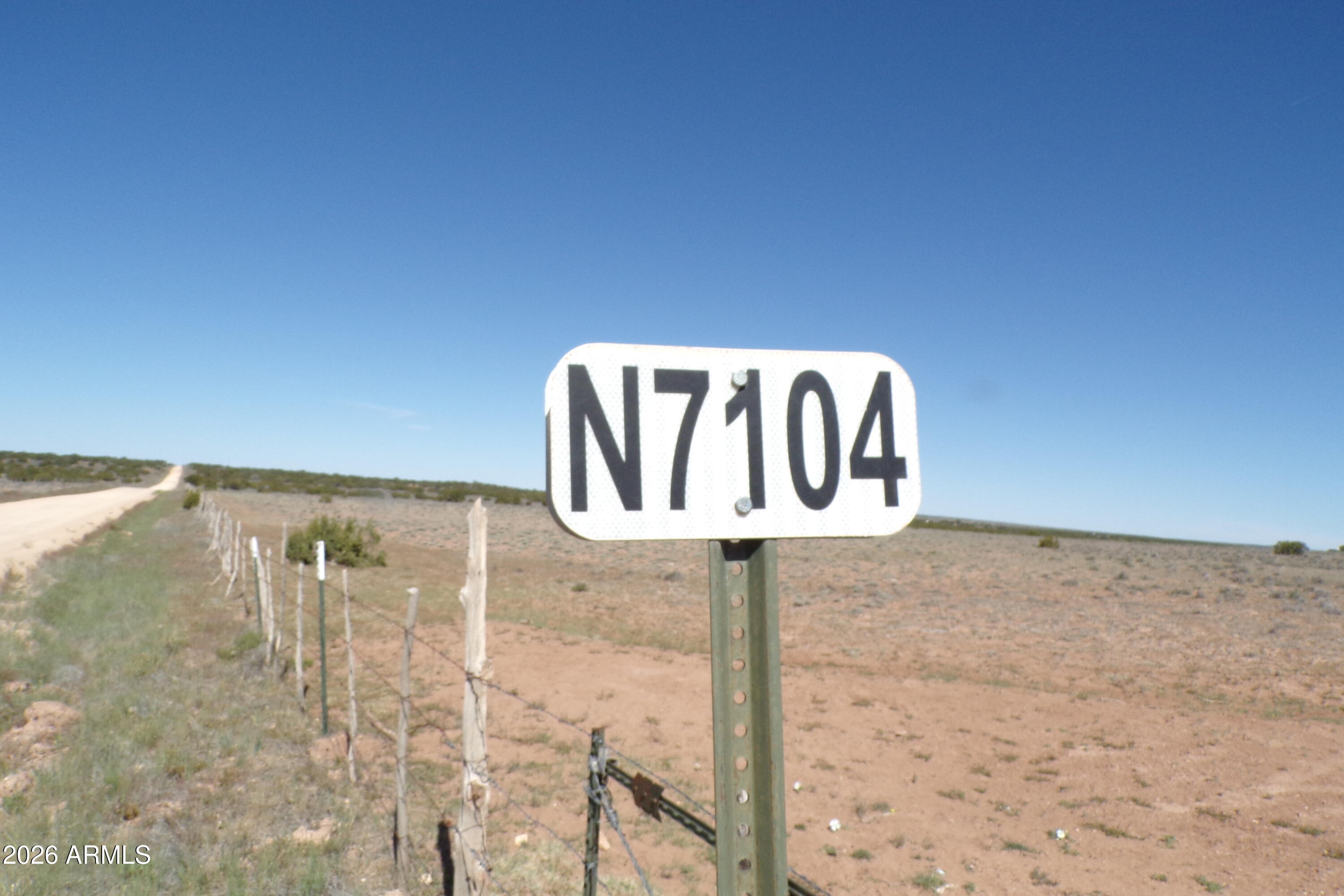 0 Ranch Road Sanders, AZ 86512 - Photo 4 of 42 a street sign sitting on top of a wall