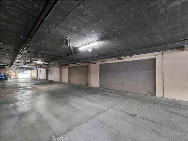 front view of a building with a tree