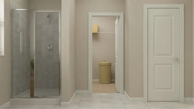 a bathroom with a shower and a sink