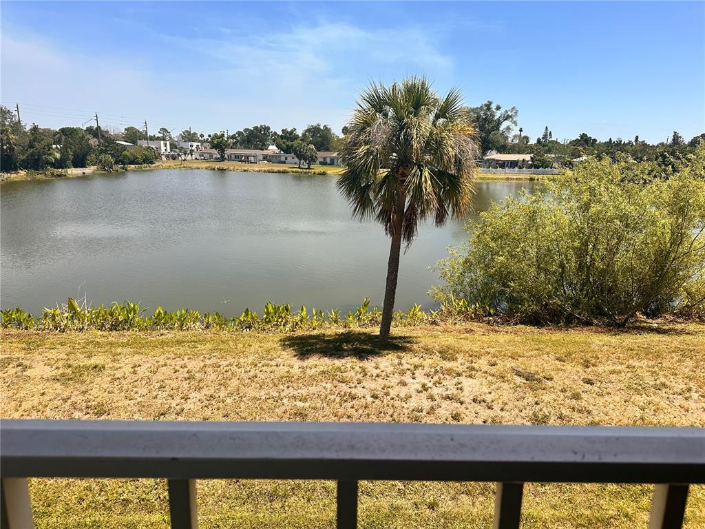 2948 Clark Road, Unit 224 Sarasota, FL 34231 - Photo 8 of 8 a view of a lake with a mountain view