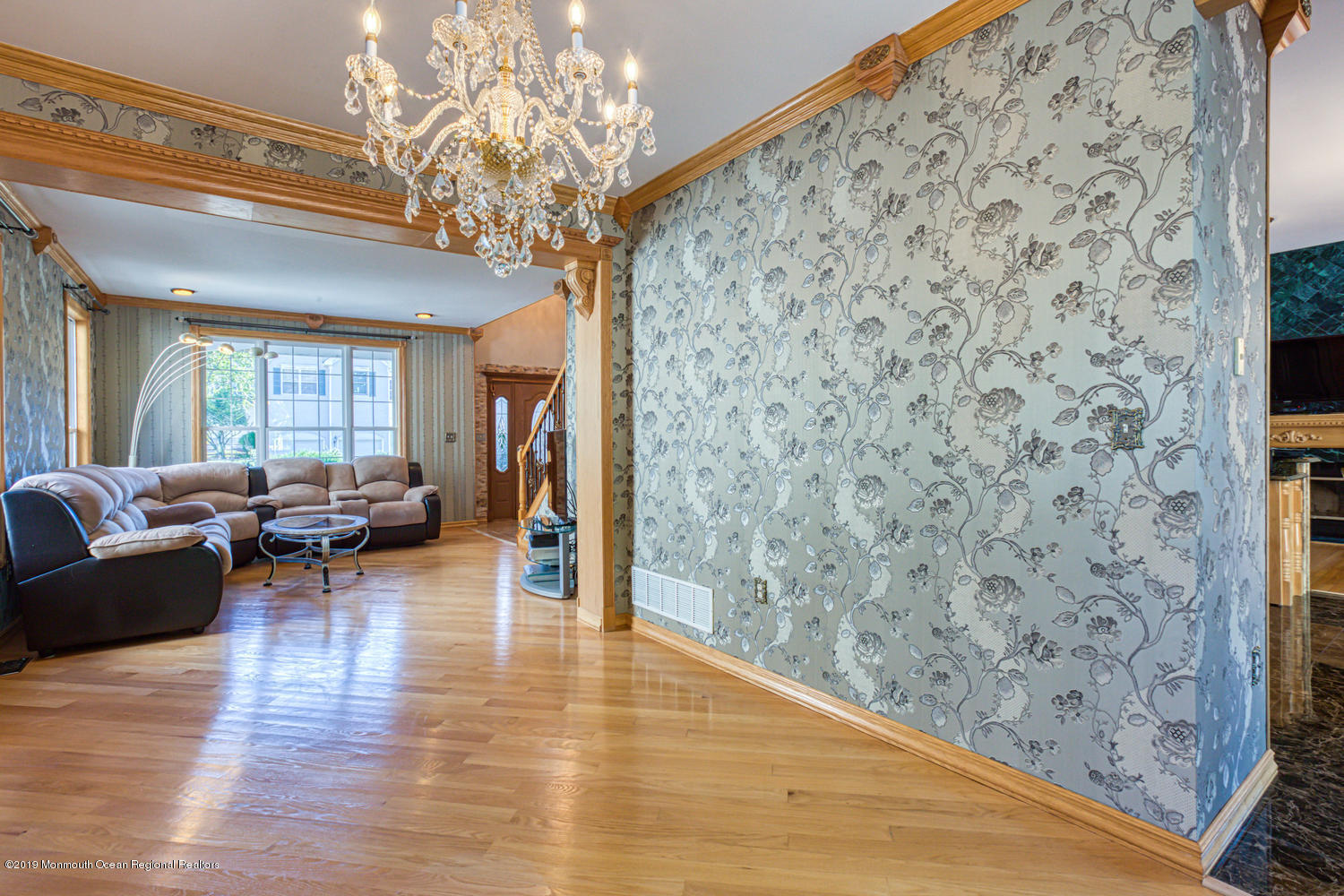327 Wedgewood Road Morganville, NJ 07751 - Photo 11 of 33 a living room with furniture and a chandelier