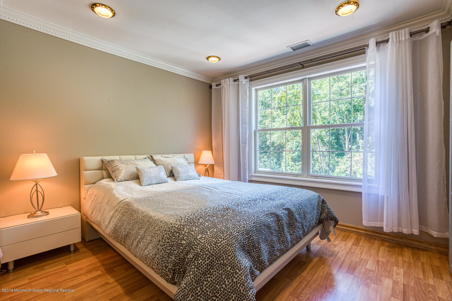 327 Wedgewood Road Morganville, NJ 07751 - Photo 19 of 33 a bedroom with a bed and a window