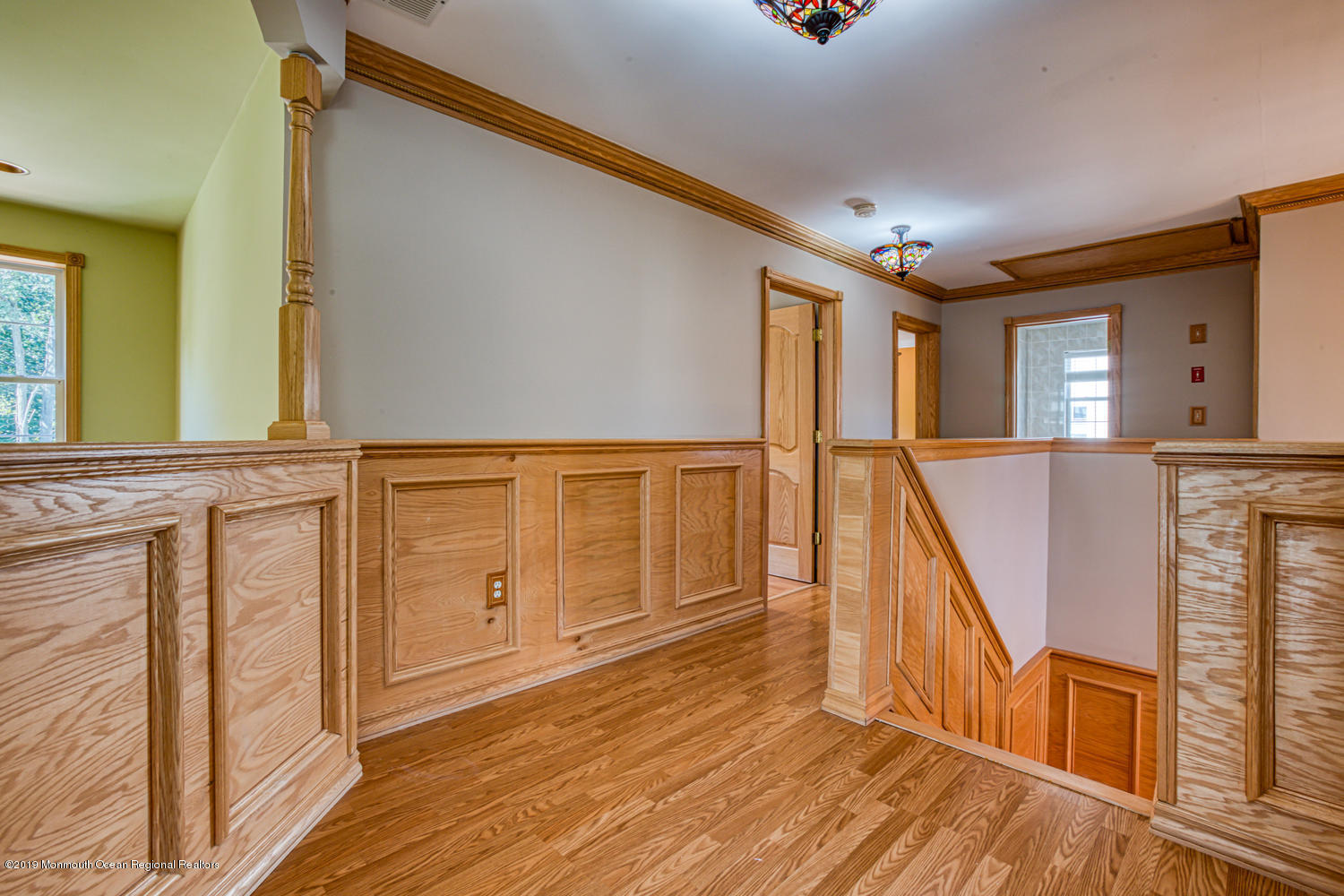 327 Wedgewood Road Morganville, NJ 07751 - Photo 21 of 33 a view of a hallway with wooden floor and staircase