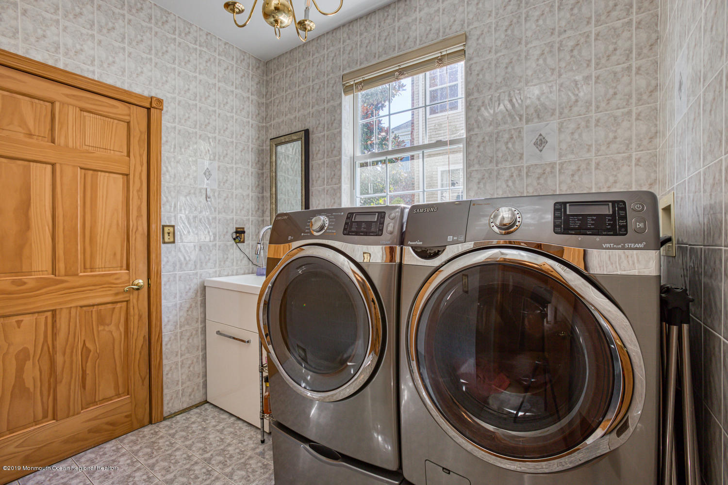 327 Wedgewood Road Morganville, NJ 07751 - Photo 23 of 33 a utility room with dryer and washer