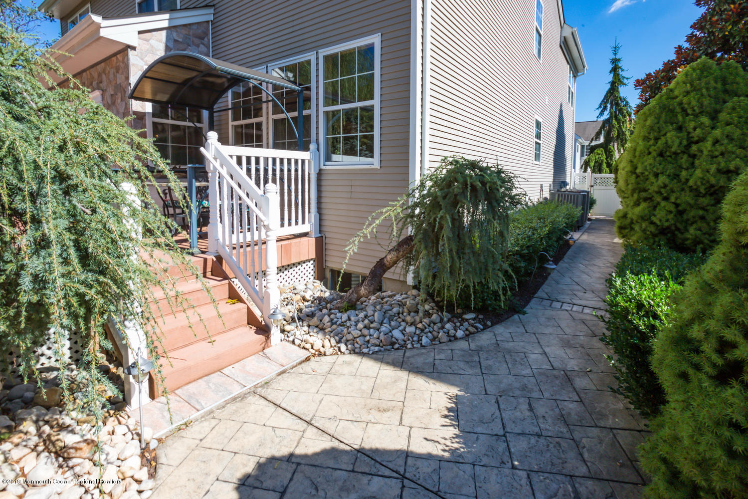327 Wedgewood Road Morganville, NJ 07751 - Photo 29 of 33 a front view of a house with a yard