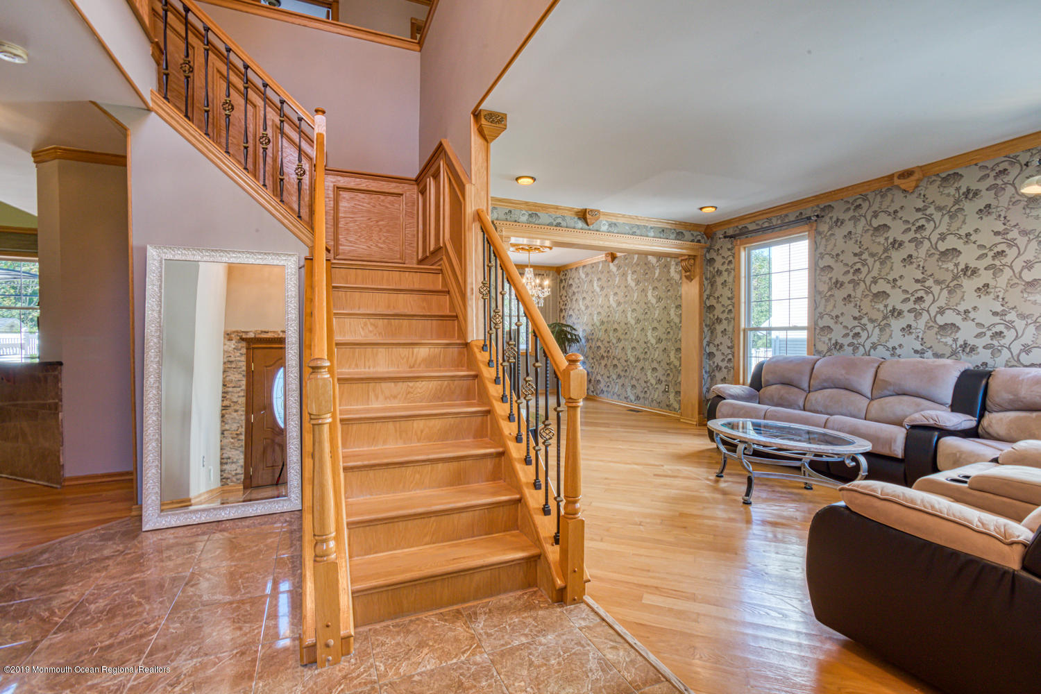 327 Wedgewood Road Morganville, NJ 07751 - Photo 3 of 33 a living room with furniture and a stairs