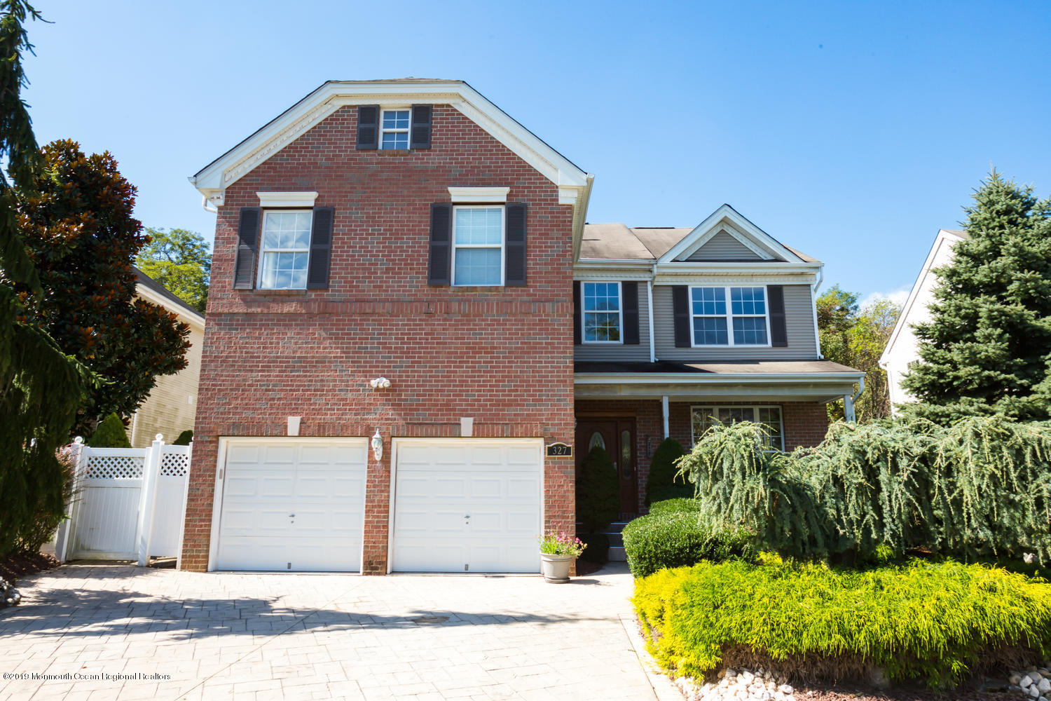 327 Wedgewood Road Morganville, NJ 07751 - Photo 33 of 33 a front view of a house with garden