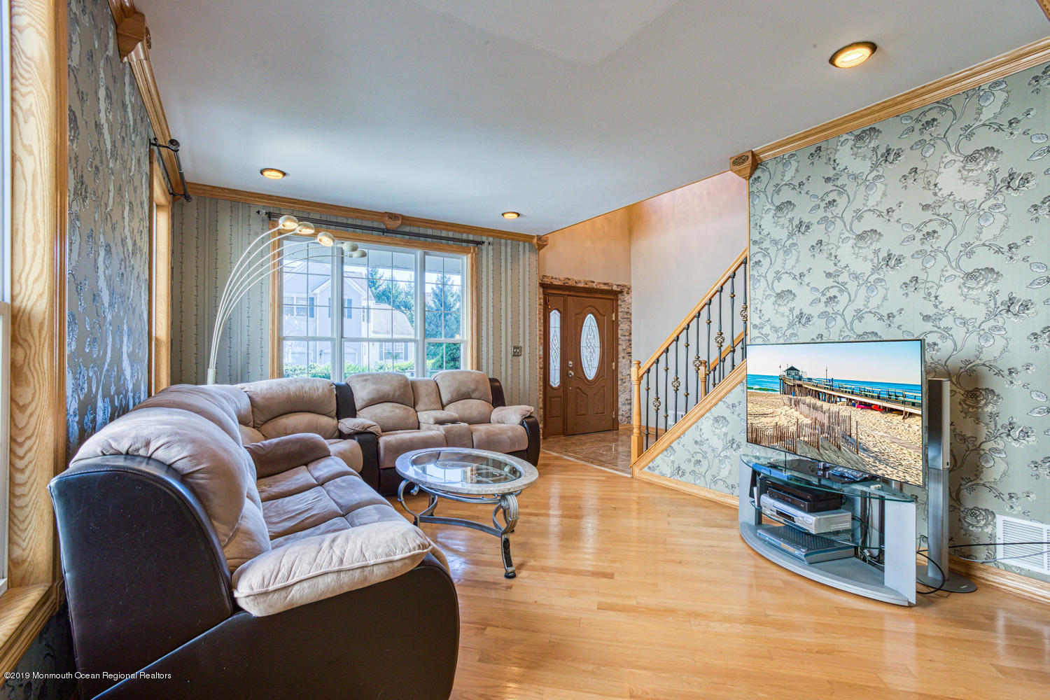 327 Wedgewood Road Morganville, NJ 07751 - Photo 10 of 33 a living room with furniture and a flat screen tv