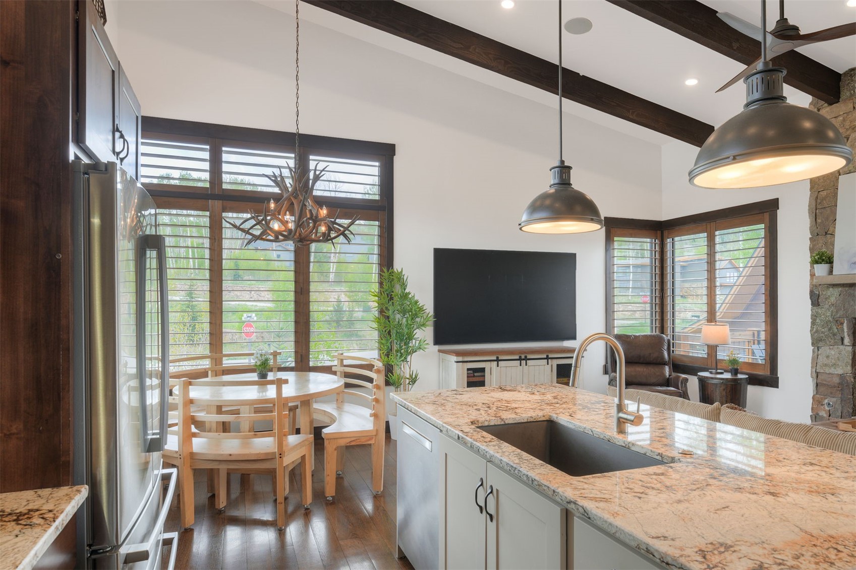 21 Moss Way Silverthorne, CO 80498 - Photo 13 of 50 a kitchen with a stove a sink and a view of living room
