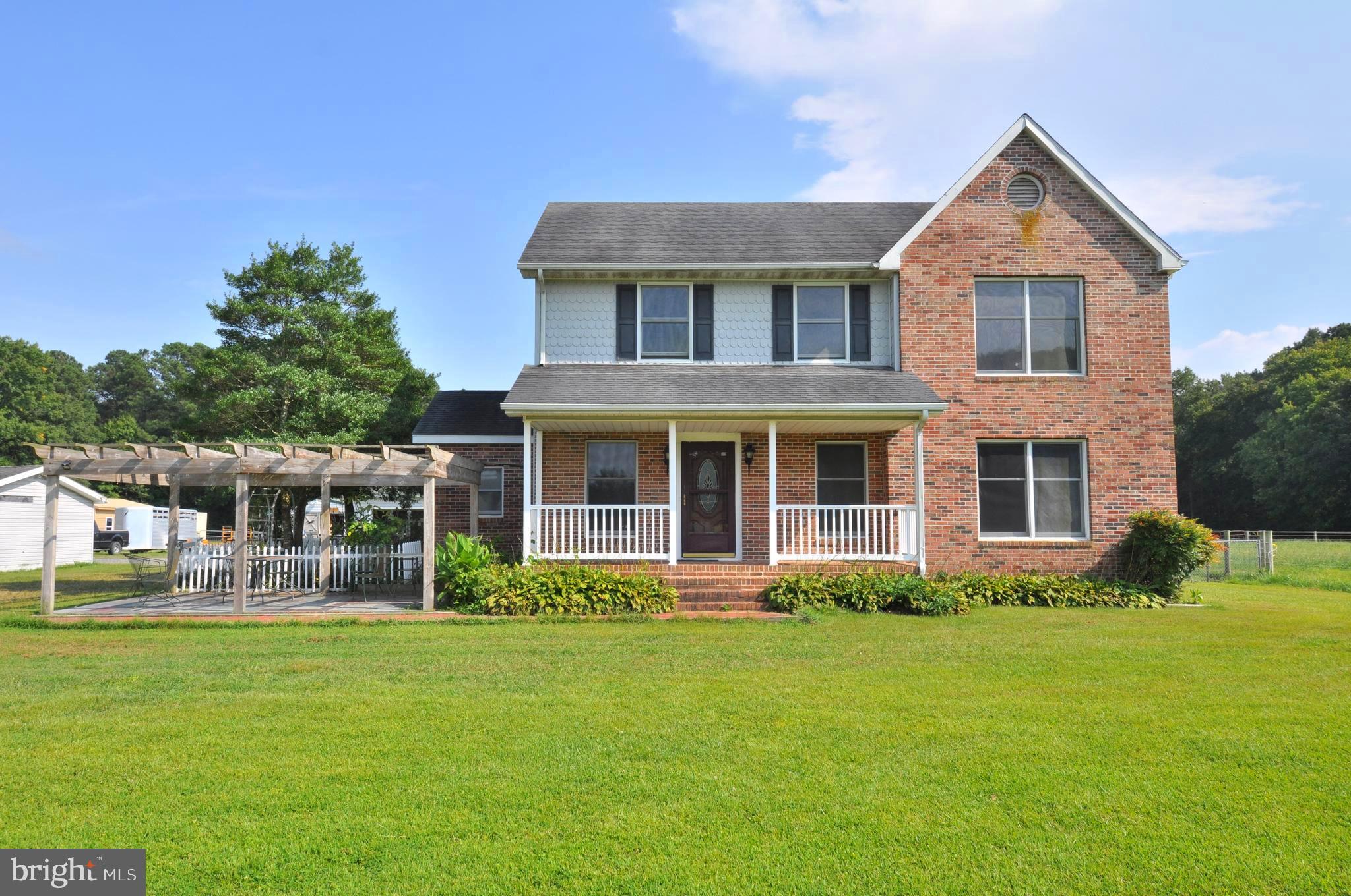 31881 Mitchell Road Princess Anne, MD 21853 - Photo 1 of 60 a front view of a house with garden and porch