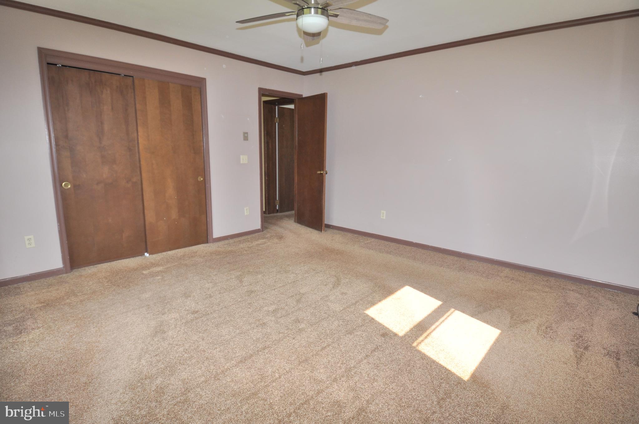 31881 Mitchell Road Princess Anne, MD 21853 - Photo 33 of 60 a view of an empty room and a ceiling fan