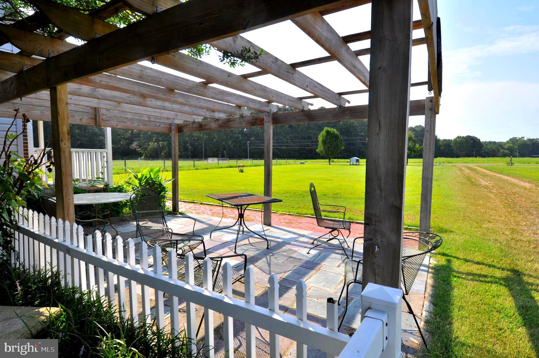 31881 Mitchell Road Princess Anne, MD 21853 - Photo 8 of 60 a view of a swimming pool with a patio and a backyard