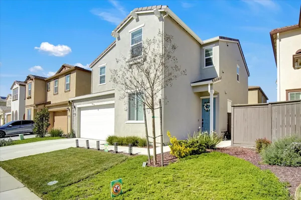 a front view of a house with a yard